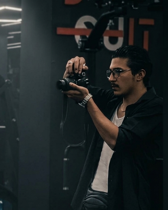 Salah Lala holding his camera